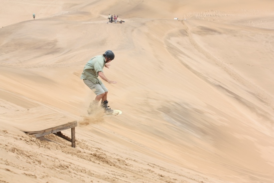 Grabbing some air on the dunes sandboarding swakopmund namibia