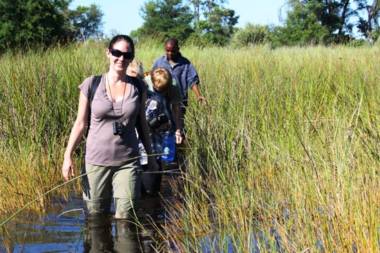 Knee Deep in mud in the Okavango Delta walking safari in the Okavango Delta